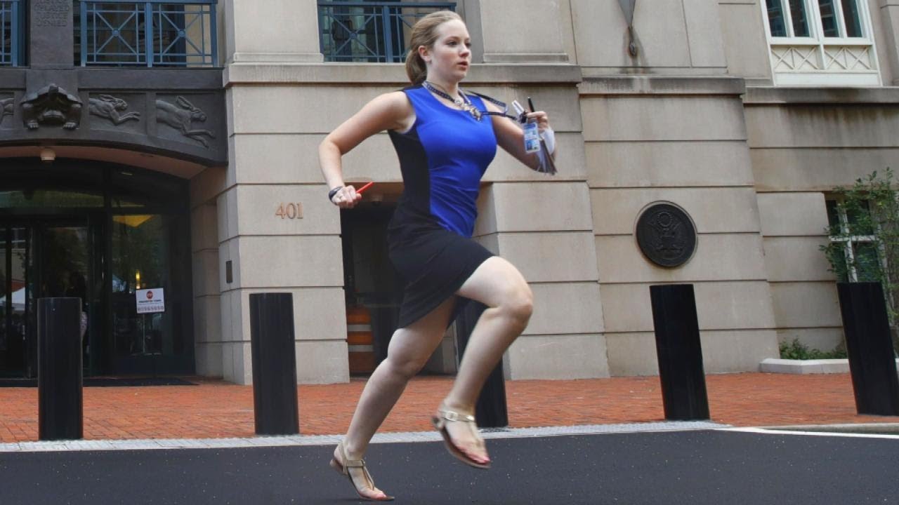 Who Is the Intern in the Blue Dress Running to Deliver Breaking News?