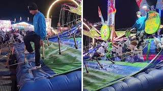 Talented guy at carnival climbs ladder backwards to win prize #shorts