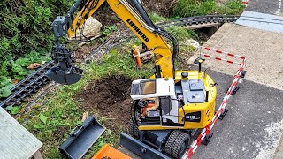 Installation of garbage collecting container. RC Excavator Liebherr A918 clamshell, Dumper, Sprinter