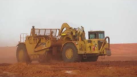 John Deere 9620R and Cat 657G scrapers