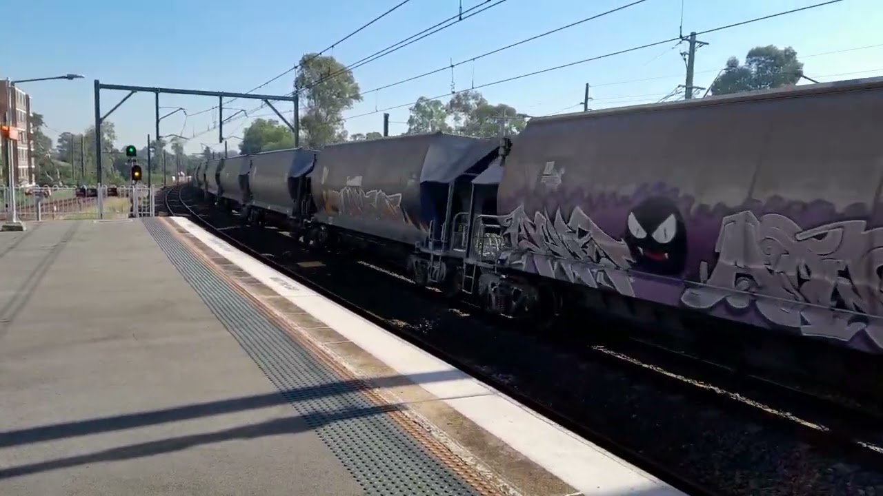 TT 103 on the rear,  passing Pendle Hill station,  east bound.