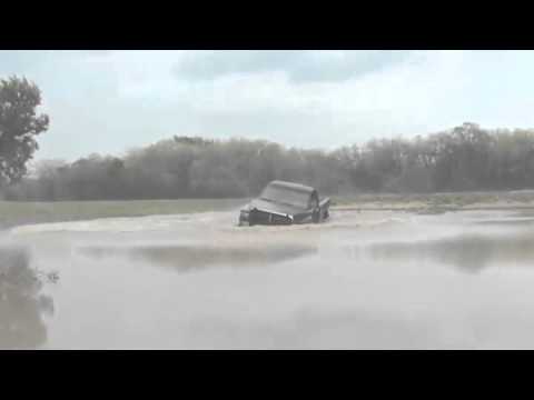 Insane driver jumps truck into pond - YouTube
