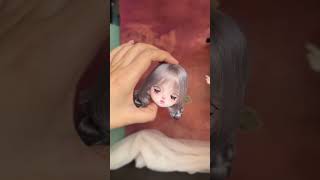 Sad Downcast-Eyed Clay Doll Head with Wig