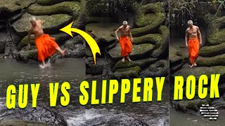 Guy Glides Over a Slippery Rock and Lands in Water