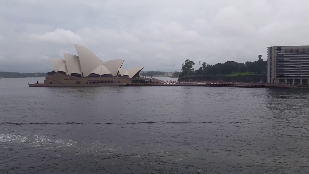 sydney schneider View of the Sydney Opera House, Harbor, Circular Quay Wharf on a Cloudy Day