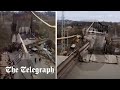 Bridge collapses onto railway in Russia