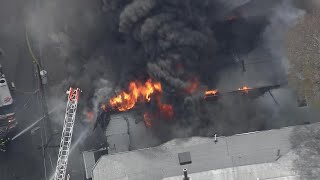 Multi-alarm fire rips through Mass. three-decker home