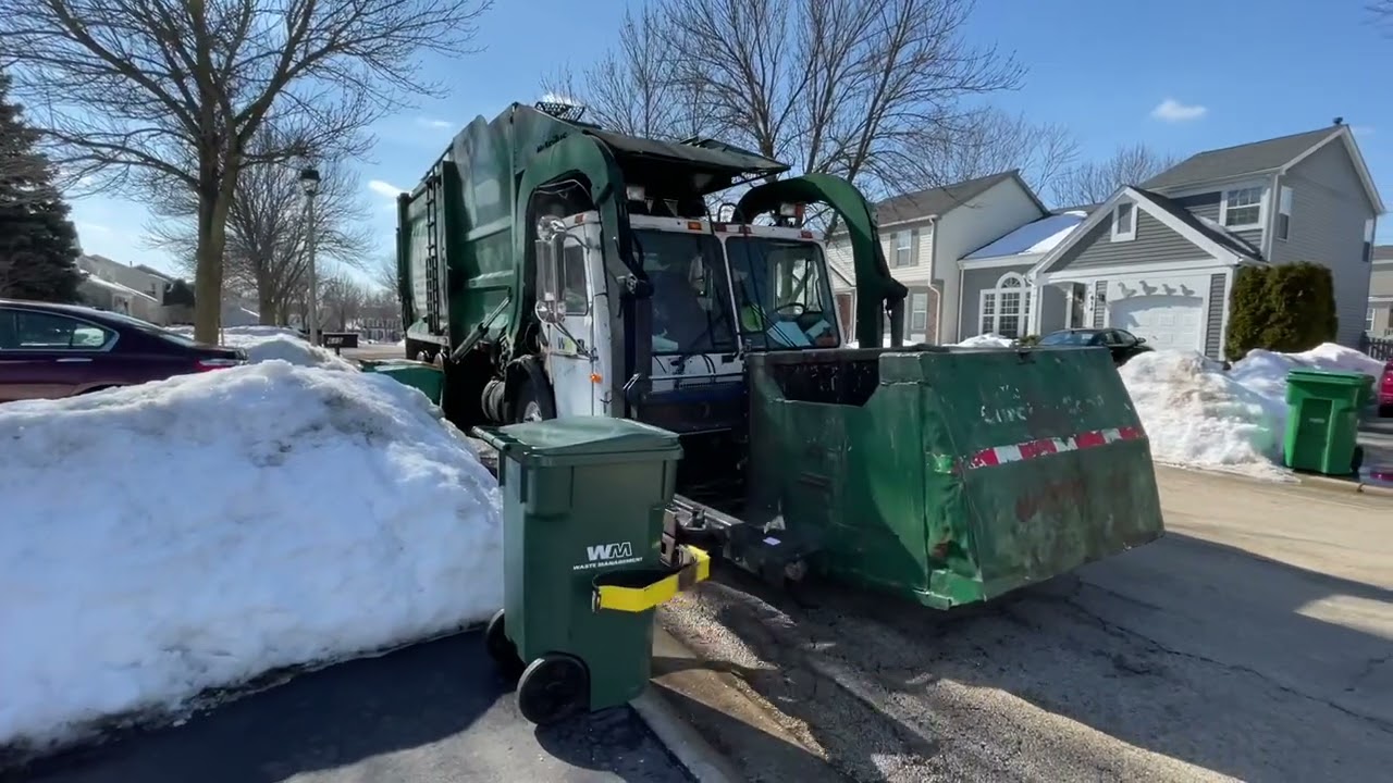 2 Old McNeilus Front Loaders with Curotto Can 2s