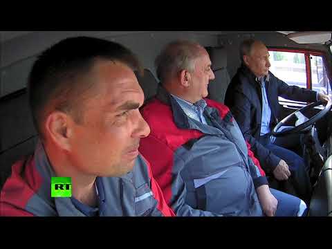 RAW: Putin drives truck across newly-opened Crimean bridge