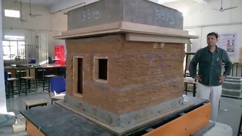 Shake table testing of adobe masonry house aided with horizontal EQ. Bands-2