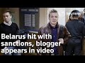 Belarus hit with sanctions, blogger appears in video