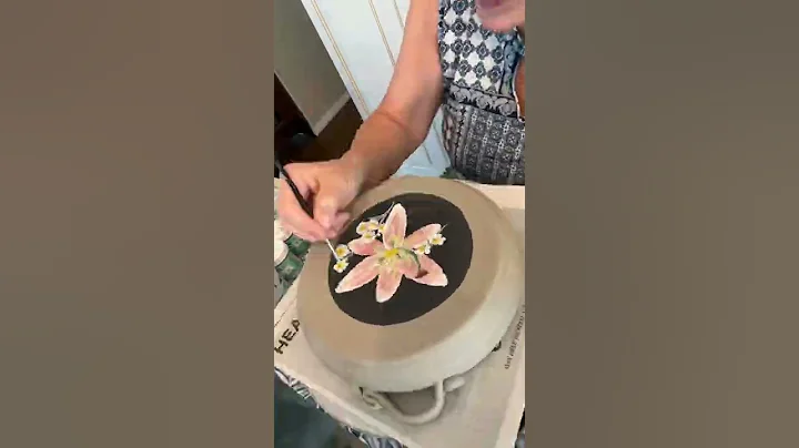 Underglazing a lily on a casserole dish