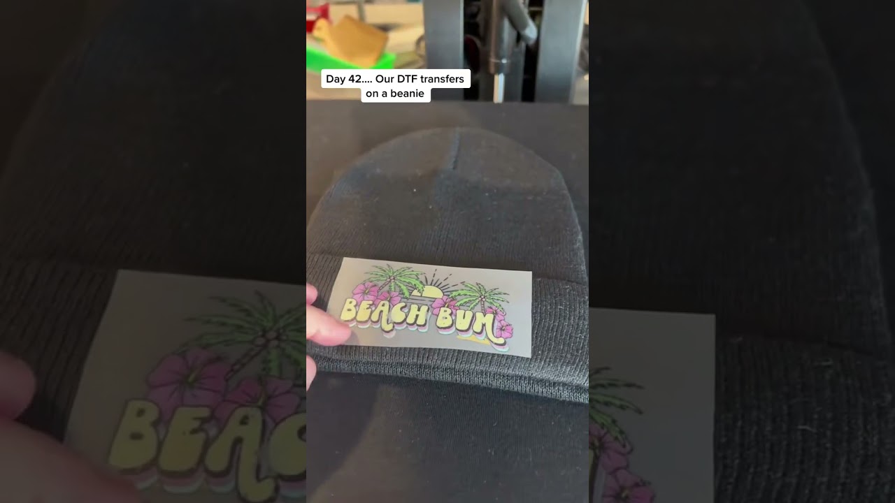 Day 42 our DTF transfers on a beanie! People ask us all the time about the stretchability so moment