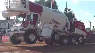 Cement truck hooked to a pulling sled