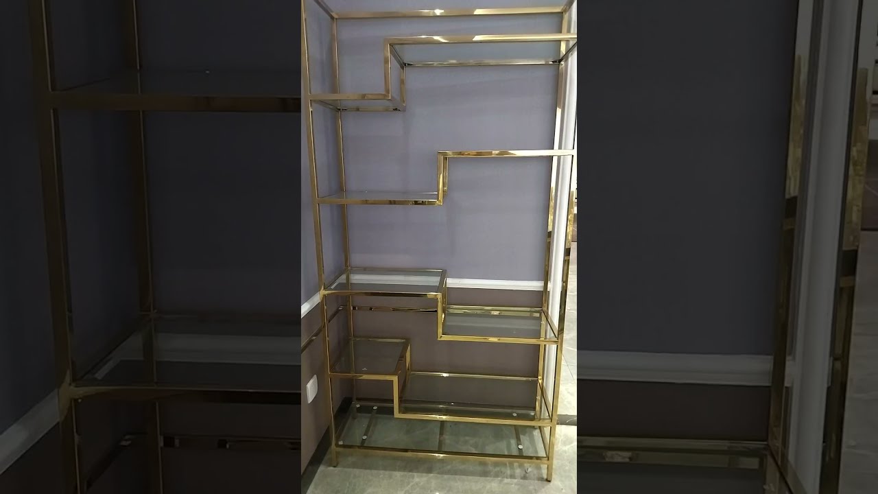 Golden metal frame shelving with glasses