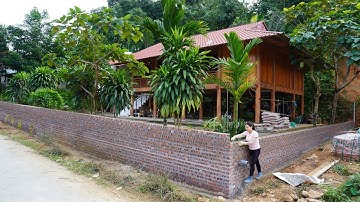 Building a solid fence around the house for Neighbors – Brick and iron wall construction