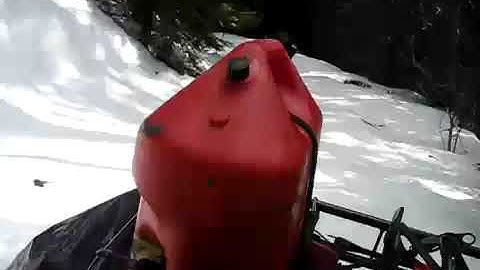 ATV in the woods in Deep Snow using Camso Tracks