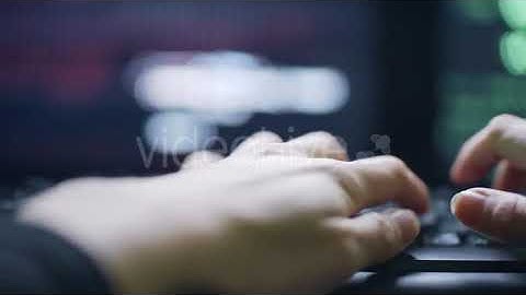 Hands of Female Hacker Typing on Black Keyboard