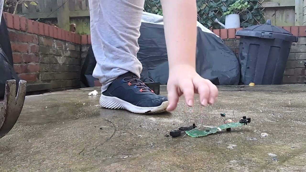 Bored bashing ps move controller and a PS4 charging dock