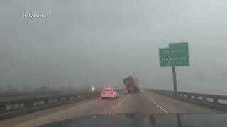 Strong winds appear to flip 18-wheeler over on I-10 in Louisiana