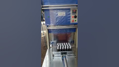 BOTTLE GROUP SHRINK WRAPPING MACHINE