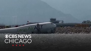 2 dead when cargo plane skids off runway in Hong Kong