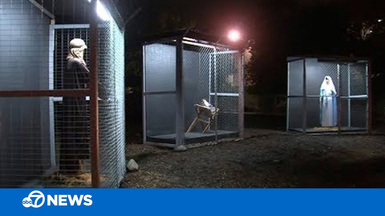 Church nativity scene depicts Jesus, Mary and Joseph as refugees in cages