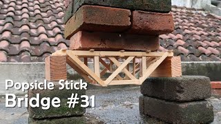 Making a strong bridge using popsicle sticks & testing it
