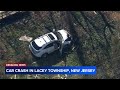 Car crashes through backyard fence in Lacey Township, NJ