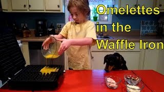 4 year old makes omelet in waffle iron   (Turn on CC for Subtitles)