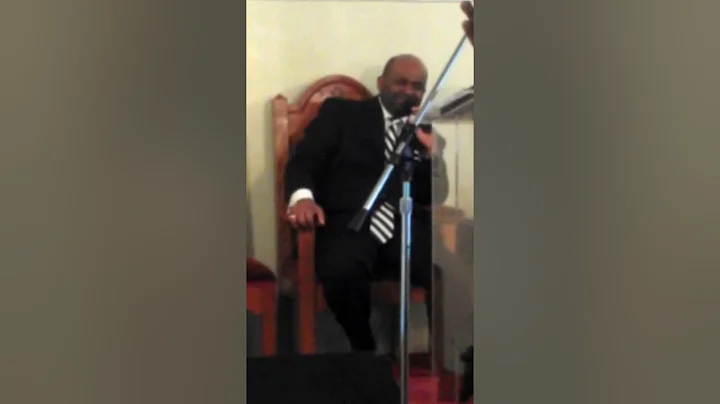PastorJulius McLean preaching and praying