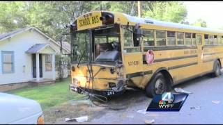 1 dead in school bus, van crash