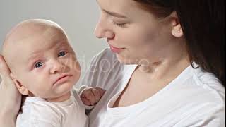 Yawning Baby on Mother’s Arms | Stock Footage - Videohive