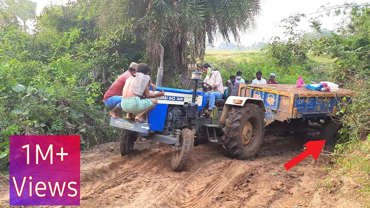 swaraj tractor stuck in mud with heavy loaded trolley| pulling out by mahindra tractor