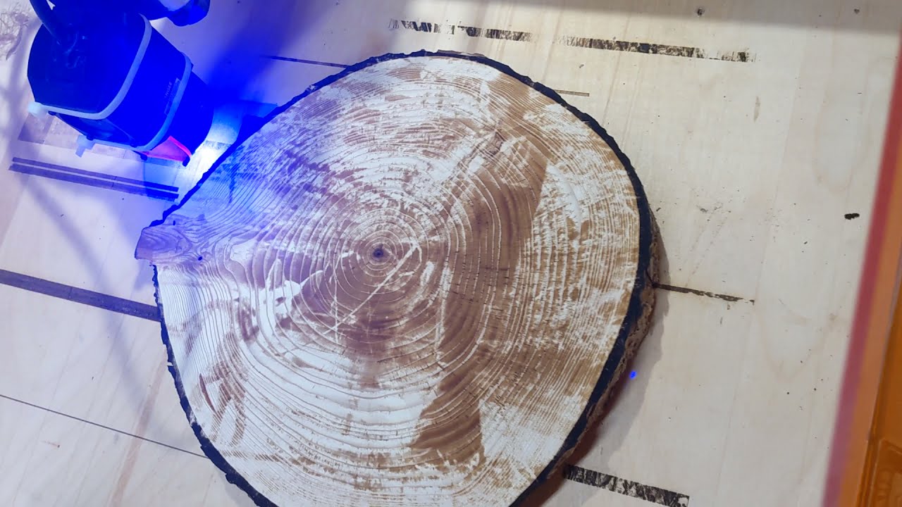 Shapeoko Pro with J Tech 7w pro laser engraving a wood round.