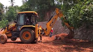 jcb 3dx cleaning and levelling soil