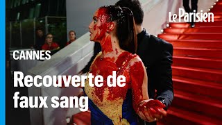 Festival de Cannes : une femme s’asperge de faux sang sur le tapis rouge