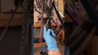Routing your bike chain through the rear derailleur