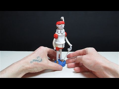 Интересная поделка получилась из корпуса электрической вилки! Фигурка пажа.