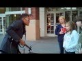 Downtown Spokane street performer Bryson Andres gives guidance to a kid