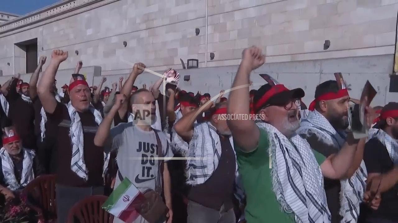 Hezbollah supporters gather in Beirut rally to show their support for Iran