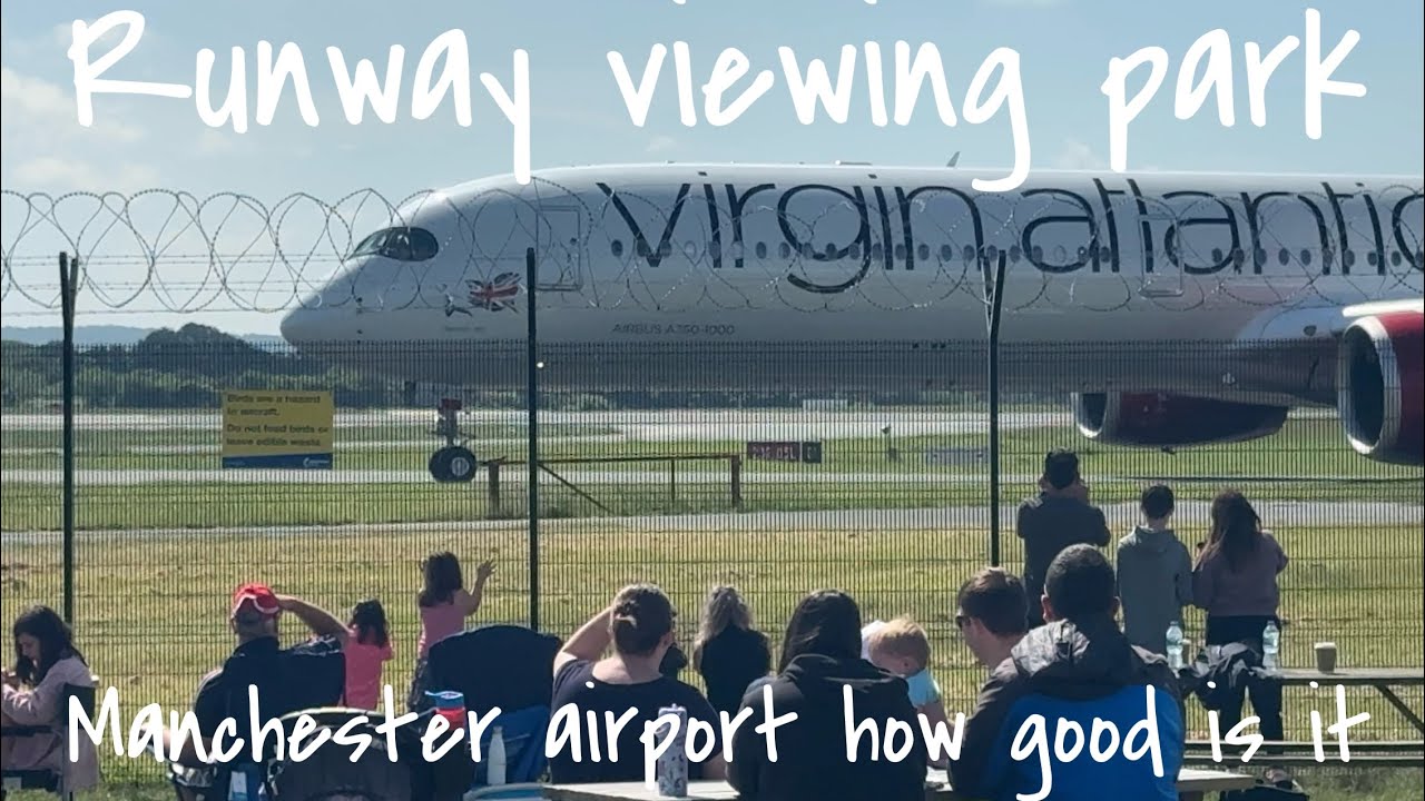 Plane watching at Runway viewing park Manchester airport on sunny cool day