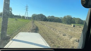 Baling hay with a case tractor and Vermeer round baler