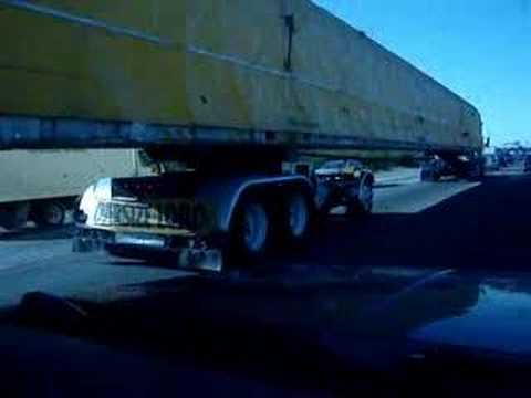 The guy driving the car is crazy! Big rig - Tractor Trailer