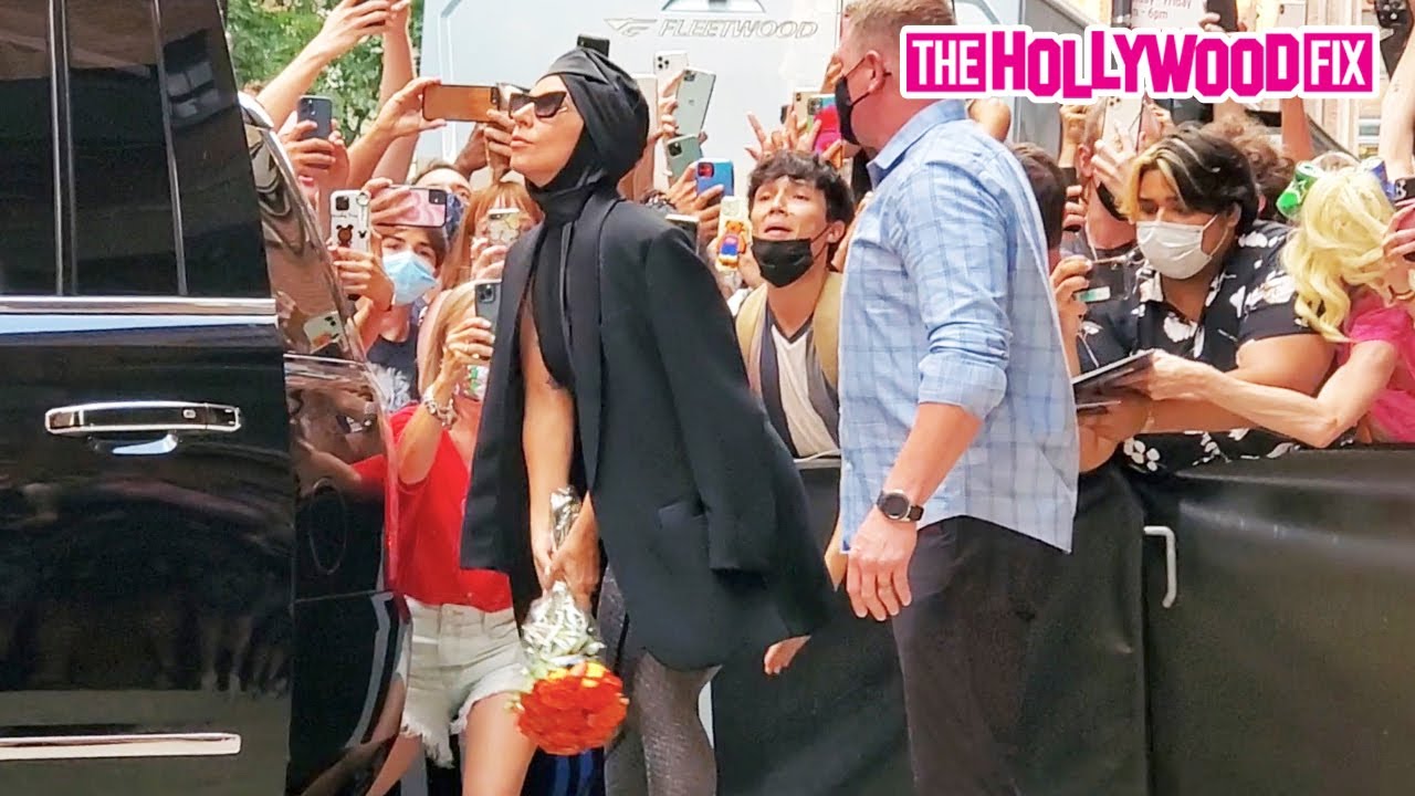 Lady Gaga Throws A Bouquet Of Flowers Out To A Mob Of Eager Fans While Leaving Milk Studios In NY