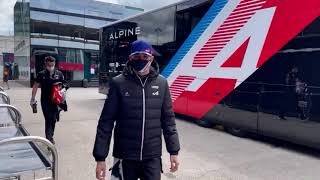 Esteban Ocon waves at the camera...