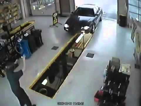 Car Falls Into Oil Changing Bay - YouTube