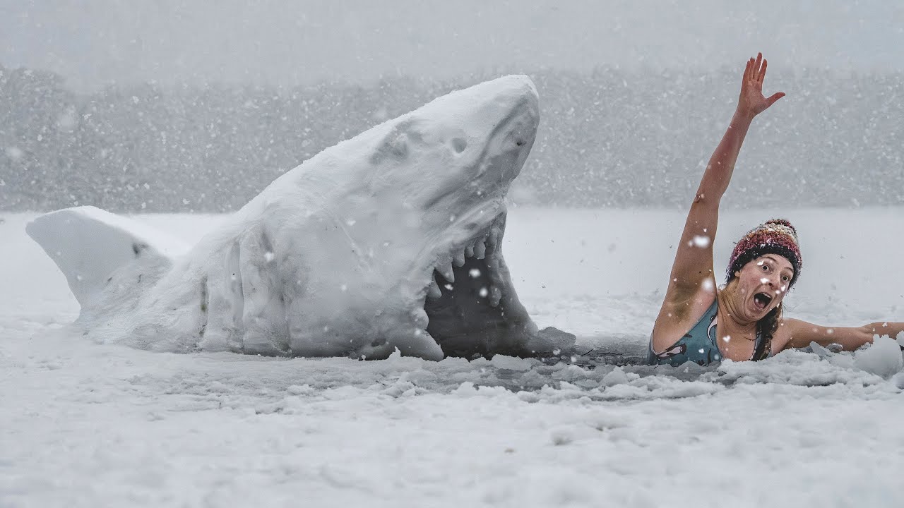 Photos show cold water swimmer in a frozen loch - with snow sharks | SWNS