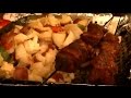 Marinated Steak Kabobs and Grilled Veggies on a Charcoal Grill Cooked on Indirect Heat