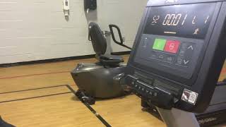 Joachim Lena at the Dunmore YMCA riding the Bike with Micheal this Morning with the Mask